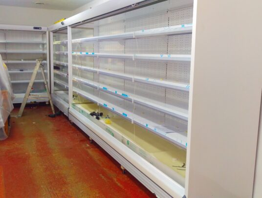 Retail refrigeration units being installed